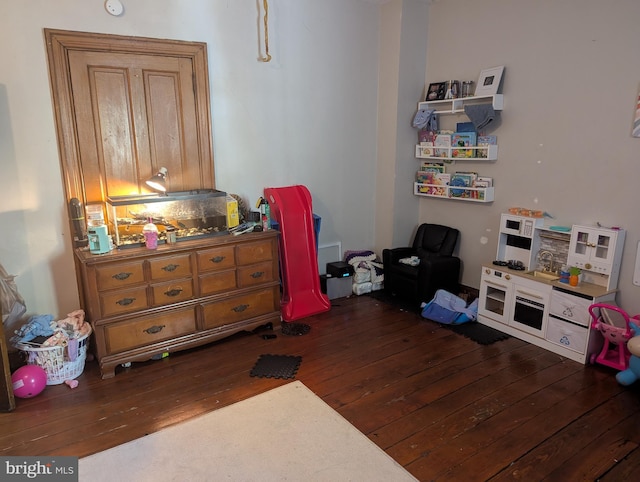 bedroom featuring dark wood-style flooring