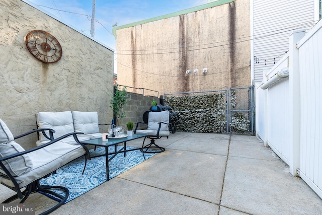 view of patio featuring a fenced backyard and outdoor lounge area