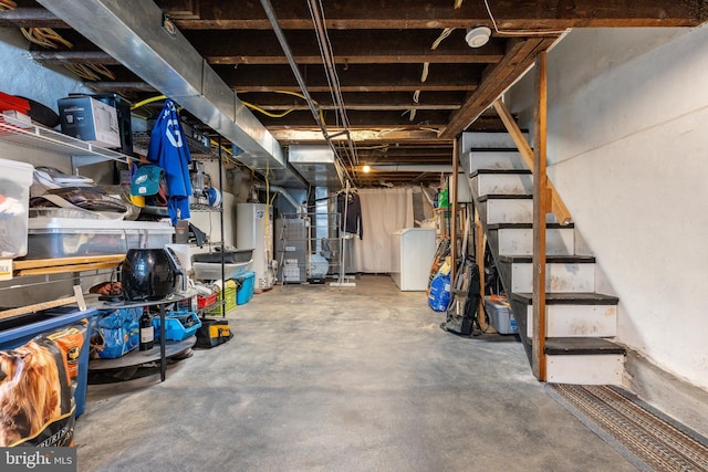 unfinished below grade area with water heater and stairway