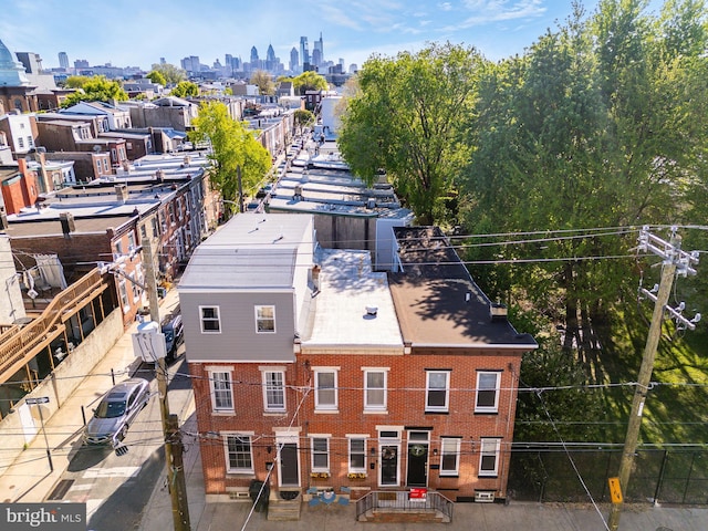 birds eye view of property with a view of city