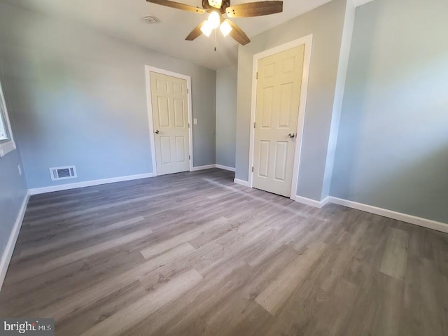 22 Maricopa Trl, Browns Mills, NJ 08015 - unfurnished bedroom with baseboards, a ceiling fan, wood finished floors, and visible vents