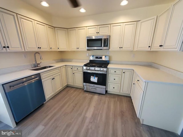 22 Maricopa Trl, Browns Mills, NJ 08015 - kitchen with wood finished floors, recessed lighting, light countertops, a sink, and appliances with stainless steel finishes