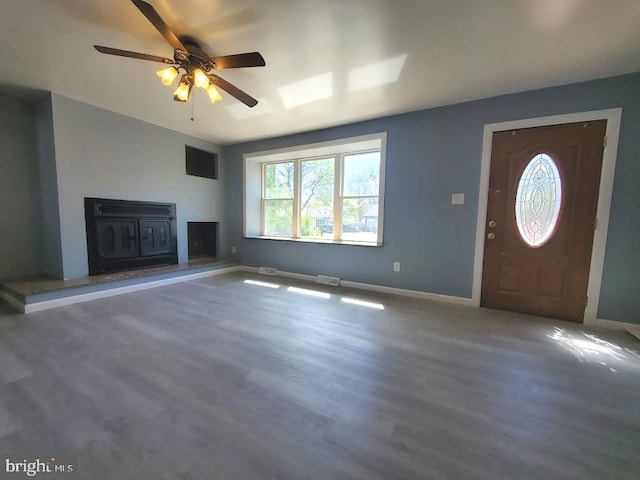 22 Maricopa Trl, Browns Mills, NJ 08015 - unfurnished living room featuring baseboards, ceiling fan, and wood finished floors