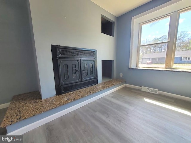 22 Maricopa Trl, Browns Mills, NJ 08015 - unfurnished living room featuring baseboards, visible vents, and wood finished floors