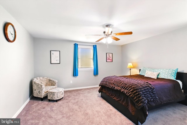 carpeted bedroom with a ceiling fan and baseboards