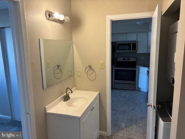 bathroom with vanity and tile patterned floors