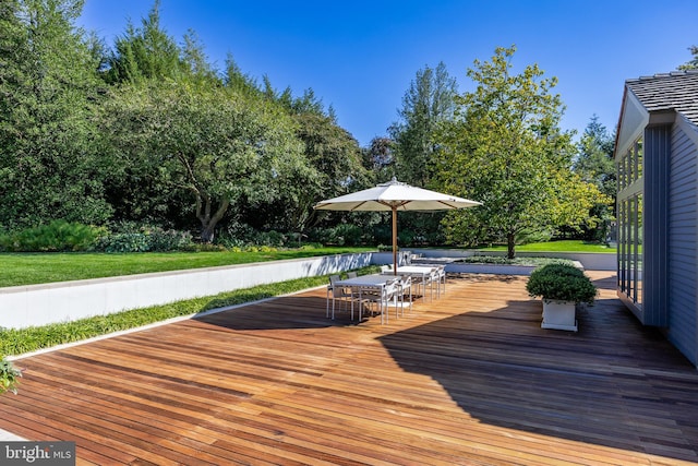 wooden deck with outdoor dining area