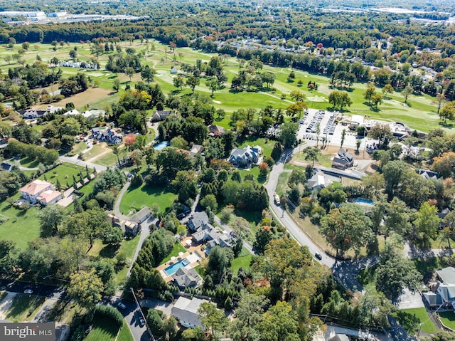 bird's eye view with view of golf course and a residential view