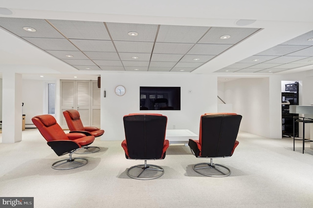 sitting room with recessed lighting, carpet flooring, and a paneled ceiling