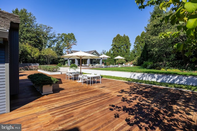 wooden deck with outdoor dining space