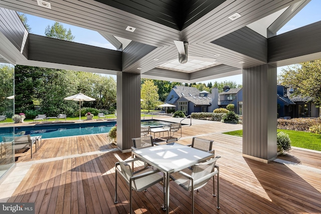 wooden deck featuring an outdoor pool