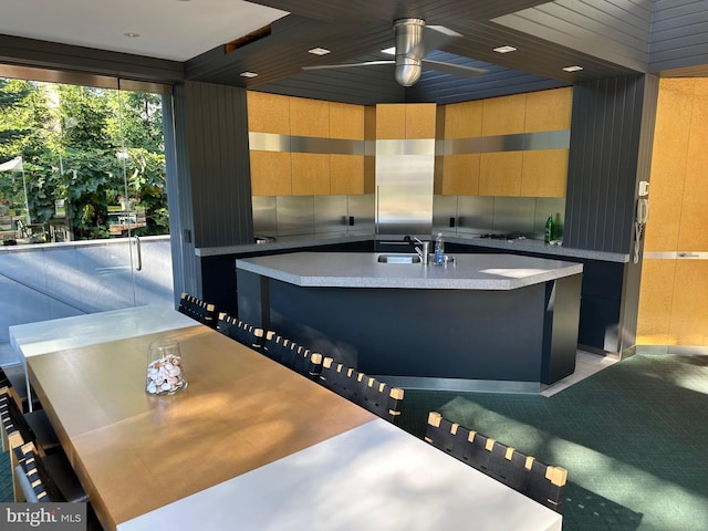 bathroom with ceiling fan and a sink