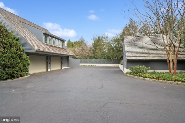 view of property exterior with fence