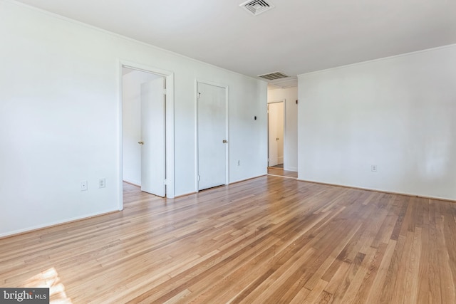 9410 Spotsylvania St, Manassas, VA 20110 - unfurnished bedroom with visible vents, light wood-style flooring, and baseboards