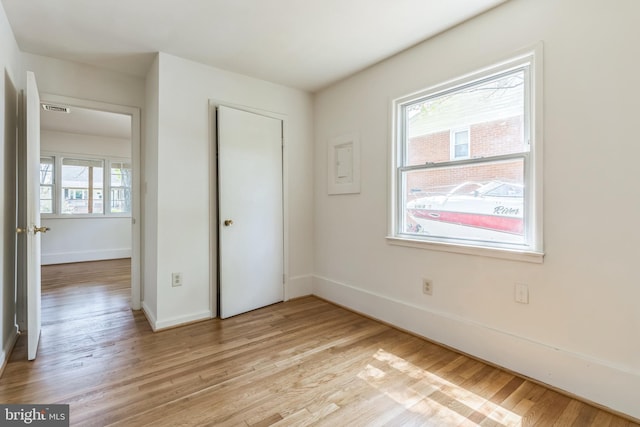 9410 Spotsylvania St, Manassas, VA 20110 - unfurnished bedroom with a closet, baseboards, visible vents, and light wood-type flooring