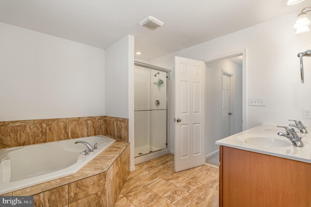 full bath with double vanity, a sink, a bath, and a shower stall