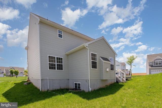 back of property with a yard