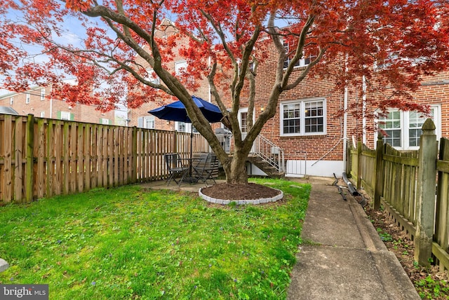 view of yard with a fenced backyard