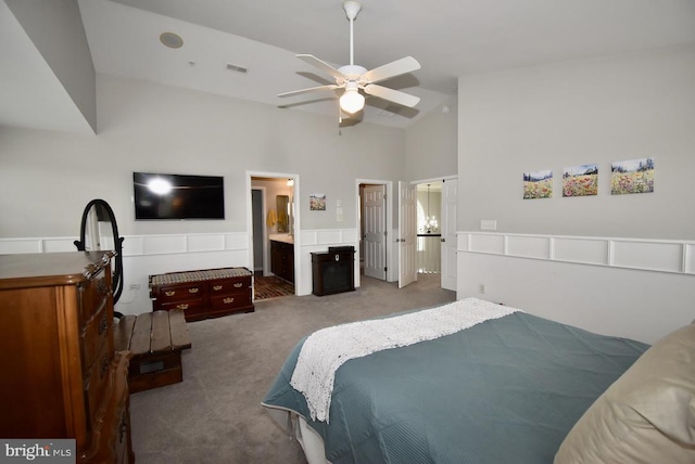 bedroom featuring connected bathroom, ceiling fan, visible vents, carpet, and high vaulted ceiling
