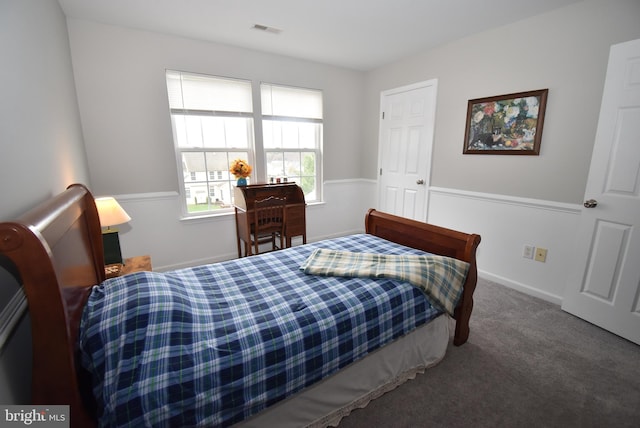 bedroom featuring visible vents and carpet