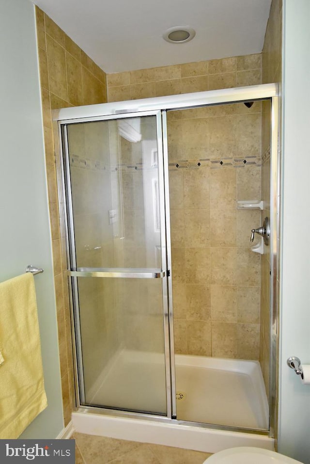 bathroom with a shower stall