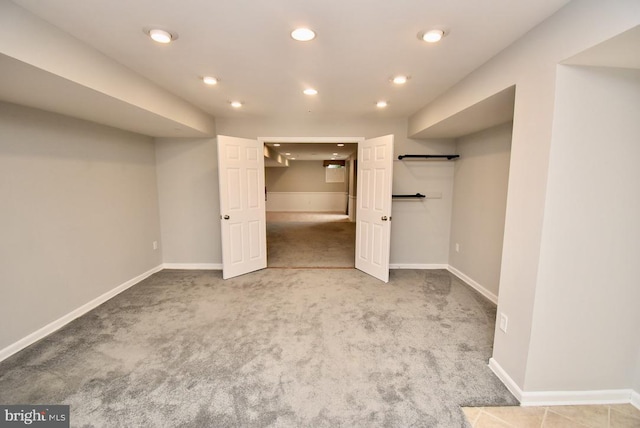 finished basement featuring baseboards, recessed lighting, and carpet floors