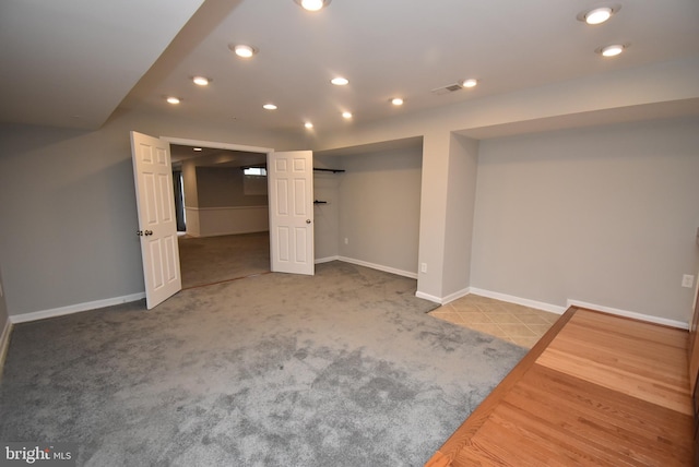 finished basement with recessed lighting, visible vents, carpet, and baseboards