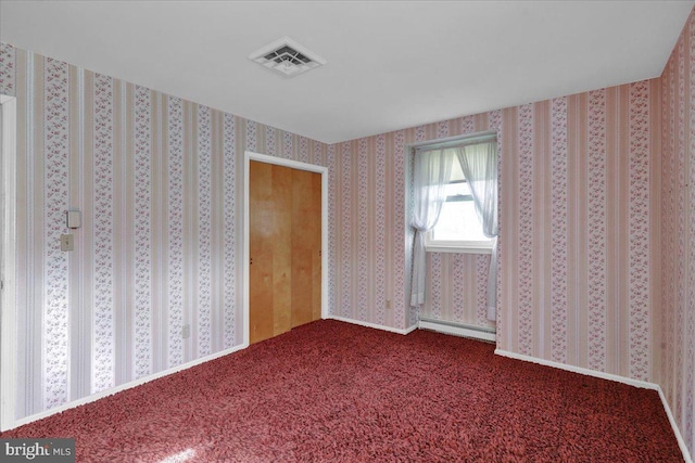 unfurnished bedroom with visible vents and carpet flooring