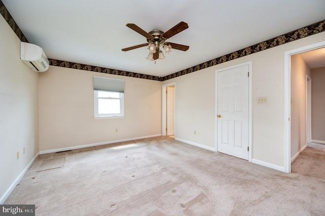 unfurnished bedroom with carpet floors, an AC wall unit, baseboards, and visible vents