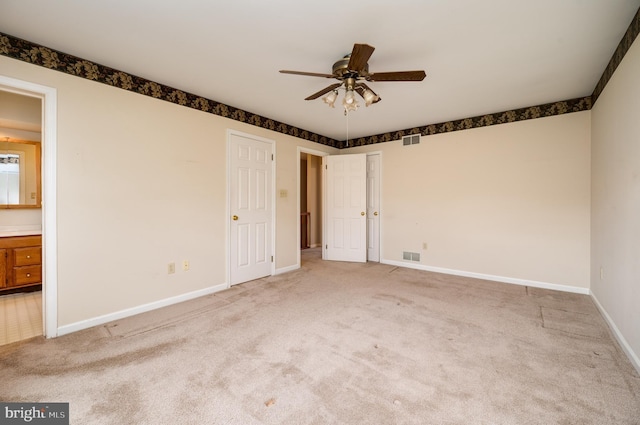 unfurnished bedroom with visible vents, baseboards, and carpet floors