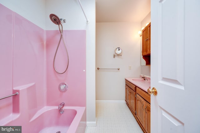 full bath featuring vanity, baseboards, and shower / washtub combination