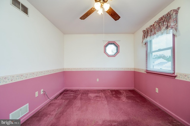 empty room with a ceiling fan, baseboards, visible vents, and carpet