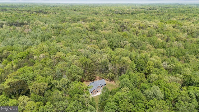 drone / aerial view with a view of trees