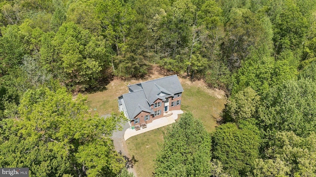 aerial view with a wooded view