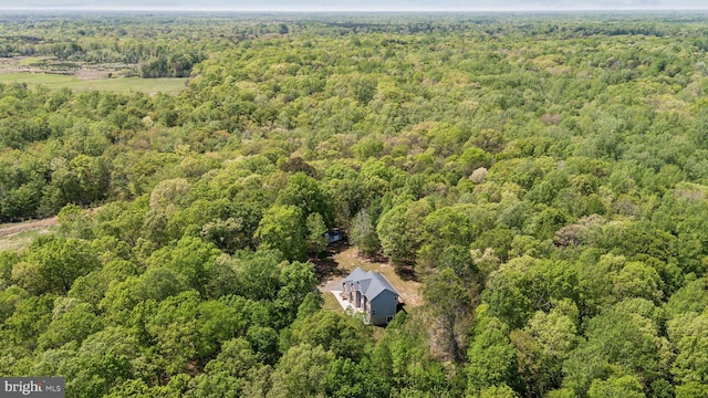 bird's eye view featuring a forest view