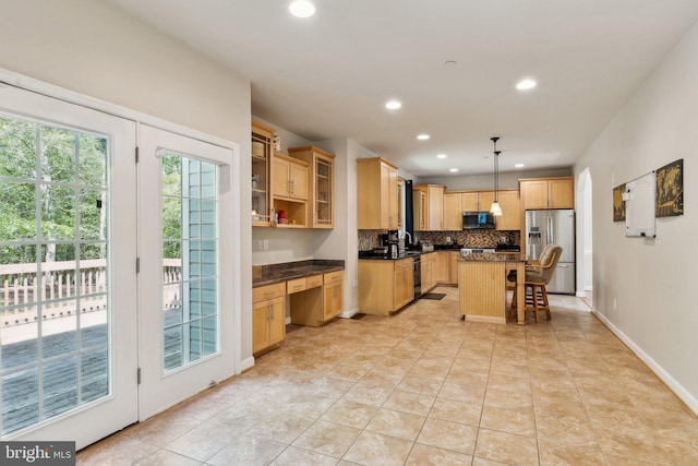 kitchen featuring decorative backsplash, light brown cabinetry, dark countertops, recessed lighting, and stainless steel appliances