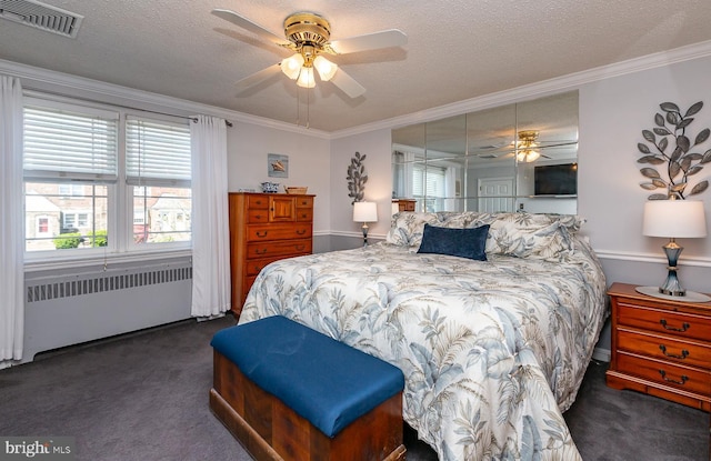 bedroom featuring visible vents, ornamental molding, carpet, and radiator heating unit