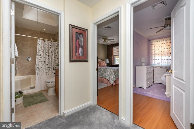 full bath featuring visible vents, connected bathroom, ceiling fan, and a shower with curtain