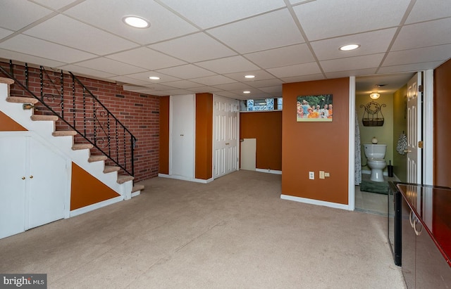 finished below grade area with baseboards, recessed lighting, carpet, and stairs