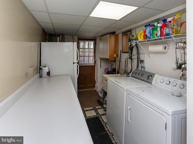 laundry room with washer and dryer and a sink