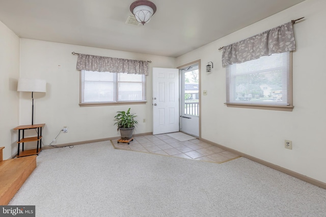 161 E Ave, Woodstown, NJ 08098 - entrance foyer with carpet, baseboards, and tile patterned floors