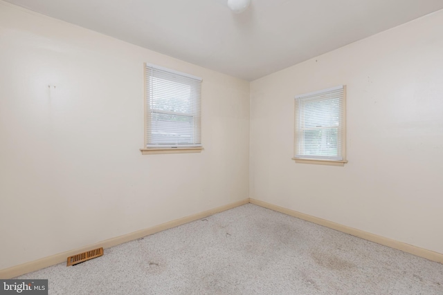 161 E Ave, Woodstown, NJ 08098 - spare room with plenty of natural light, carpet flooring, and baseboards