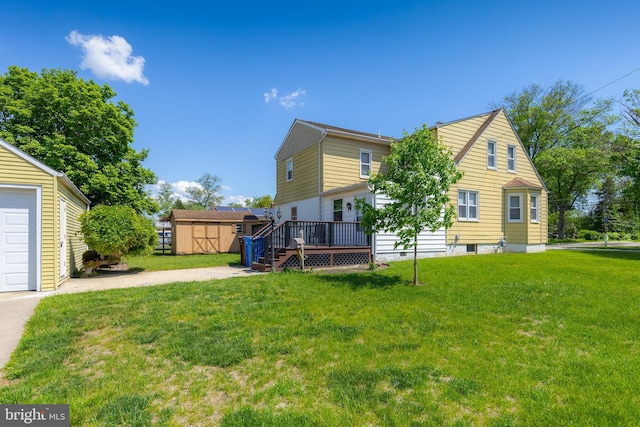 161 E Ave, Woodstown, NJ 08098 - rear view of property featuring an outbuilding, a wooden deck, a yard, and a storage shed