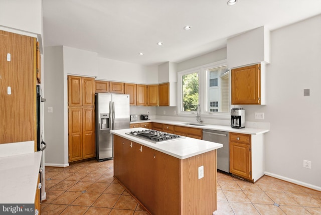 20665 Shoal Pl, Sterling, VA 20165 - kitchen featuring stainless steel appliances, a center island, light tile patterned floors, light countertops, and recessed lighting