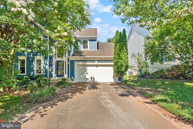 20665 Shoal Pl, Sterling, VA 20165 - view of front of home with driveway, roof with shingles, and a garage