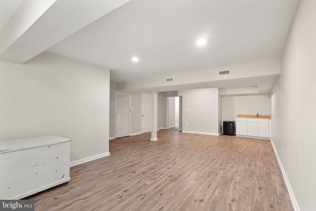20665 Shoal Pl, Sterling, VA 20165 - below grade area with light wood-style flooring, recessed lighting, and bar area