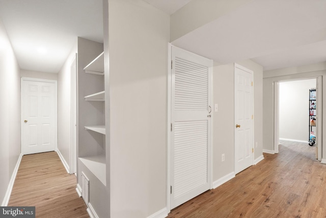 20665 Shoal Pl, Sterling, VA 20165 - hall featuring light wood finished floors and baseboards