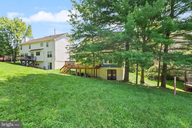 20665 Shoal Pl, Sterling, VA 20165 - view of green lawn with a wooden deck, french doors, and stairs