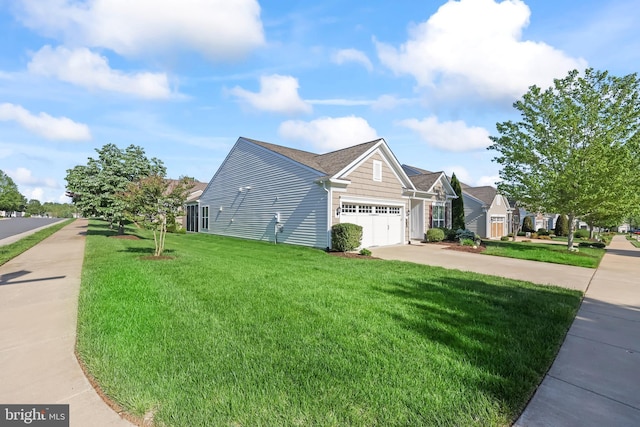 view of side of property featuring a lawn, concrete driveway, and a garage
