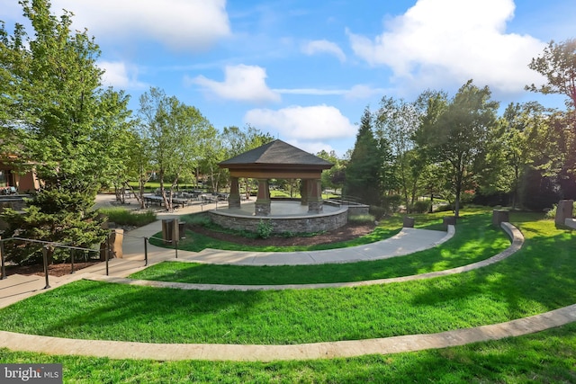 surrounding community featuring a gazebo and a lawn